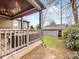 Covered porch with comfortable seating, offering a relaxing outdoor space with views of the backyard at 2009 Charlotte Dr, Charlotte, NC 28203