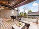 Inviting covered porch with comfortable seating and a grill, perfect for outdoor entertaining at 2009 Charlotte Dr, Charlotte, NC 28203