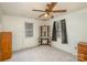 Empty bedroom with a ceiling fan, neutral walls, and carpeted floor, awaiting personal touches at 202 Hovis Rd, Stanley, NC 28164