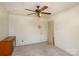 Empty bedroom with ceiling fan and neutral walls, offering a blank canvas for personalization at 202 Hovis Rd, Stanley, NC 28164