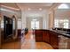 Well-lit kitchen with stainless steel appliances, granite countertops, and custom wood cabinetry at 2129 Jack Wilson Rd, Shelby, NC 28150