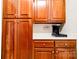 Detailed shot of laundry room cabinets and coffee maker at 2129 Jack Wilson Rd, Shelby, NC 28150