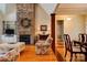 Cozy living room showcasing a stone fireplace, hardwood floors, and stylish furnishings at 2129 Jack Wilson Rd, Shelby, NC 28150