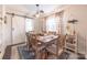 Bright dining room featuring a modern light fixture, decorative rug, and curtains at 2308 Arnold Dr, Charlotte, NC 28205