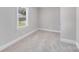 Cozy bedroom with a window providing natural light and neutral carpet at 2328 Edison St, Charlotte, NC 28206