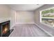 Inviting living room with a classic fireplace, neutral decor, soft carpeting, and natural light at 2328 Edison St, Charlotte, NC 28206
