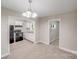 Open-concept living room showcasing light-filled kitchen with modern appliances at 2328 Edison St, Charlotte, NC 28206