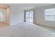 Bright bedroom featuring plush carpeting, natural light, and sliding glass doors leading to the outdoors at 239 Damask Dr, Lancaster, SC 29720