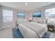 Bright bedroom with large windows, decorative bedside lamps and neutral decor at 239 Damask Dr, Lancaster, SC 29720