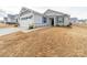 A lovely single-Gathering home showcasing a well-kept lawn and a two-car garage with traditional design elements at 239 Damask Dr, Lancaster, SC 29720