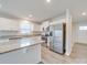 Modern kitchen with stainless steel appliances, granite countertops, and ample natural light at 239 Damask Dr, Lancaster, SC 29720