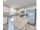 Bright kitchen featuring granite countertops, stainless steel appliances, and ample cabinet space at 239 Damask Dr, Lancaster, SC 29720