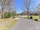 Scenic walking path featuring park bench, trash receptacle and beautiful green space at 2710 Goneaway Rd, Charlotte, NC 28210