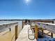 Waterfront property featuring a private wooden dock with seating and ladder on Lake Wylie at 3030 Point Clear Dr, Tega Cay, SC 29708