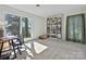 Bright home office features a large window with water views, built in book shelves, and neutral paint at 3030 Point Clear Dr, Tega Cay, SC 29708