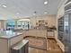 Spacious kitchen with granite counters, stainless steel appliances and lake view from the beautiful bay window at 3030 Point Clear Dr, Tega Cay, SC 29708