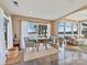 Bright living room with neutral paint, tile floors, large windows with beautiful views of the lake at 3030 Point Clear Dr, Tega Cay, SC 29708