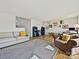 Spacious living room features wood flooring, neutral paint, and a decorative black and white striped rug at 3030 Point Clear Dr, Tega Cay, SC 29708
