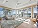 Spacious living area with waterfront views, hardwood floors, recessed lighting, and a ceiling fan at 3030 Point Clear Dr, Tega Cay, SC 29708