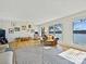 Inviting living room with hardwood floors, natural light, comfortable seating, and scenic water views at 3030 Point Clear Dr, Tega Cay, SC 29708