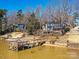 Lakefront property with a private dock and access to the water for boating and recreation at 3030 Point Clear Dr, Tega Cay, SC 29708