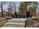 Outdoor stone patio with a fire pit and seating for outdoor relaxation and enjoyment at 341 Beckwick Ln, Concord, NC 28025