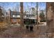 View of the beautiful landscaped yard, glass enclosed patio, and brick home exterior at 341 Beckwick Ln, Concord, NC 28025