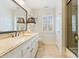 Light and airy bathroom featuring a large vanity, mirror, and glass enclosed shower at 341 Beckwick Ln, Concord, NC 28025