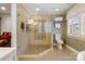 Modern bathroom with a glass-enclosed shower, tiled walls, and elegant fixtures at 341 Beckwick Ln, Concord, NC 28025