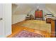 Charming bedroom with a comfortable bed, antique furniture, and a patterned rug at 341 Beckwick Ln, Concord, NC 28025