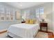 Cozy bedroom with soft lighting, hardwood floors, and large windows with plantation shutters at 341 Beckwick Ln, Concord, NC 28025