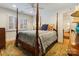 Elegant bedroom with a four-poster bed, hardwood floors, and classic decor at 341 Beckwick Ln, Concord, NC 28025