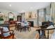 Elegant dining room with fireplace, wooden table, and antique furniture at 341 Beckwick Ln, Concord, NC 28025