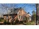 Charming brick home featuring manicured landscaping and classic architectural details at 341 Beckwick Ln, Concord, NC 28025