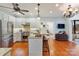 Bright kitchen features stainless steel appliances, granite countertops, and a kitchen island with seating at 341 Beckwick Ln, Concord, NC 28025