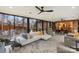 Bright living room featuring modern ceiling fans, floor-to-ceiling windows, and an open layout at 341 Beckwick Ln, Concord, NC 28025