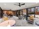 Bright living room featuring modern ceiling fans, floor-to-ceiling windows, and an open layout at 341 Beckwick Ln, Concord, NC 28025