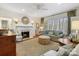 Cozy living room with fireplace, comfortable seating, and large windows allowing natural light at 341 Beckwick Ln, Concord, NC 28025