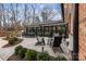 Outdoor brick patio with a dining table and seating perfect for outdoor enjoyment at 341 Beckwick Ln, Concord, NC 28025