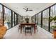 Bright sunroom with floor-to-ceiling windows and an indoor-outdoor living and dining space at 341 Beckwick Ln, Concord, NC 28025