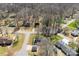 An aerial view of a quiet neighborhood street lined with mature trees and well-maintained homes at 345 Briar Creek Rd, Gastonia, NC 28056