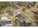 An aerial view shows the property surrounded by lush trees in a well-established neighborhood at 345 Briar Creek Rd, Gastonia, NC 28056