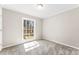 Bedroom with carpet and large window with natural light at 345 Briar Creek Rd, Gastonia, NC 28056