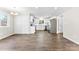 Open dining area featuring hardwood floors and modern white cabinets at 345 Briar Creek Rd, Gastonia, NC 28056