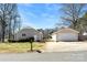 Charming home with a detached garage, wooden deck, and paved driveway at 345 Briar Creek Rd, Gastonia, NC 28056