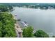 Stunning lakefront property with private boat docks, lush greenery, and picturesque water views at 3675 West Bay Dr, Sherrills Ford, NC 28673