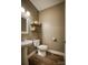 Half bathroom features modern fixtures, vanity sink, and stylish decorative shelves at 3675 West Bay Dr, Sherrills Ford, NC 28673