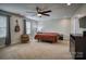 Primary bedroom with neutral carpet, a ceiling fan, and ample natural light at 3675 West Bay Dr, Sherrills Ford, NC 28673