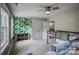 Bright bedroom with patterned wallpaper, ceiling fan, and built-in storage at 3675 West Bay Dr, Sherrills Ford, NC 28673