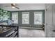Bedroom with multiple windows and tropical style wallpaper at 3675 West Bay Dr, Sherrills Ford, NC 28673